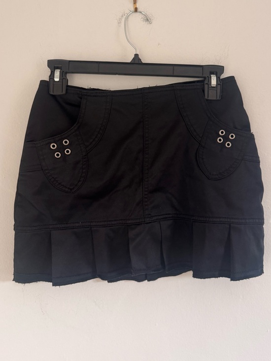 Diva Dresses & Skirts - Black Pleated Mini Skirt with Grommet Pocket Detail